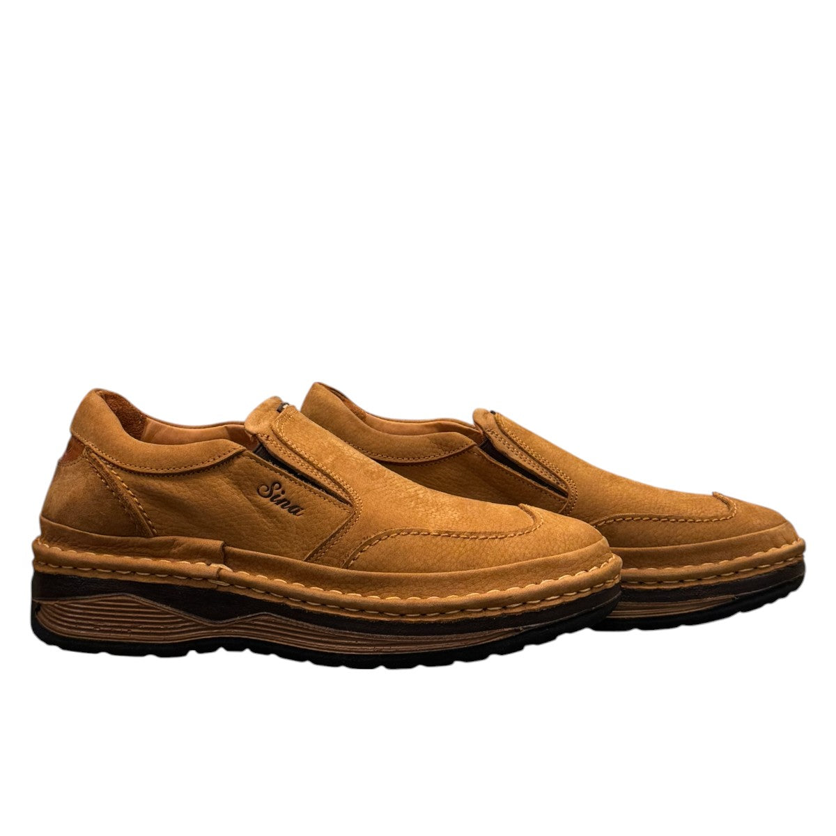 Sina Footwear Tonkbon brown leather slip-on shoes with handmade stitching and a durable dark brown sole. Photo of side views.