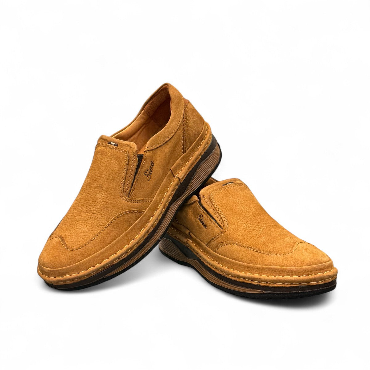 Sina Footwear Tonkbon brown leather slip-on shoes with handmade stitching and a durable dark brown sole. Photo of upper view.