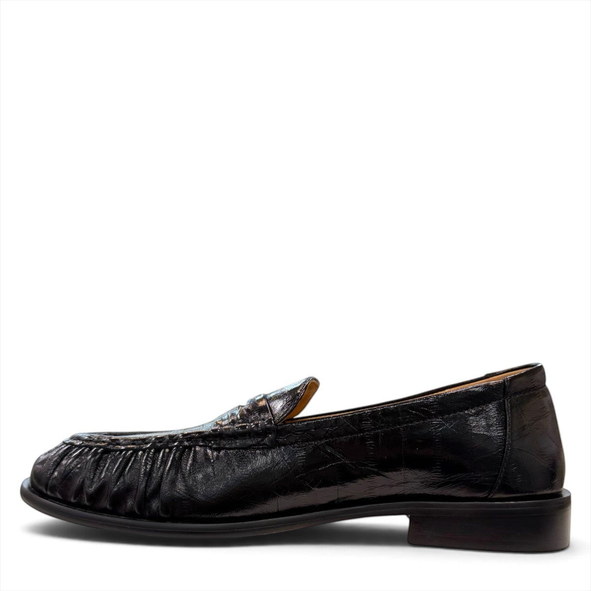 Sina Footwear wine-colored genuine leather loafer with hand-finished gathered detailing and a durable rubber outsole.
photo of the left side