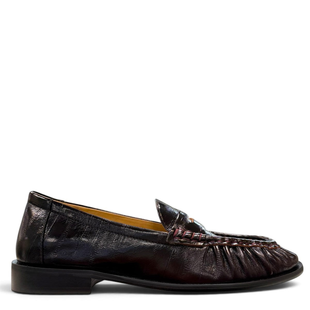 Sina Footwear wine-colored genuine leather loafer with hand-finished gathered detailing and a durable rubber outsole.
photo of the right side