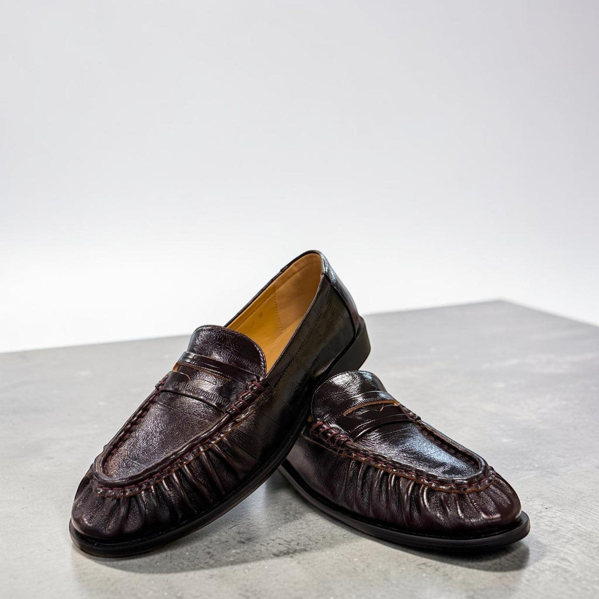 Sina Footwear wine-colored genuine leather loafer with hand-finished gathered detailing and a durable rubber outsole.
photo of the front side