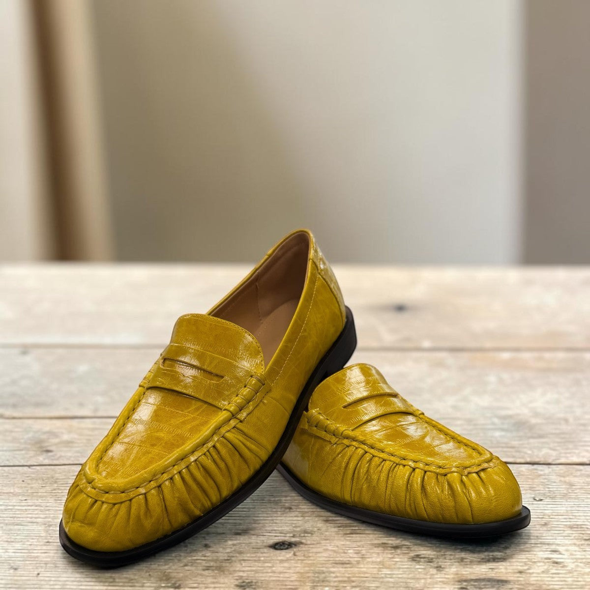 Sina Footwear yellow genuine leather loafer with hand-finished gathered detailing and a durable rubber outsole.
photo of the front side