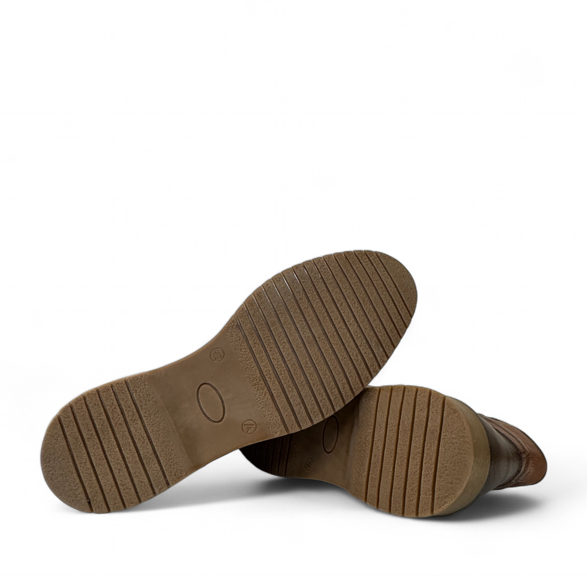 Sina Footwear Zagros brown leather boot with elastic side panels, handmade stitching, and rubber outsole. Photo of bottom view.