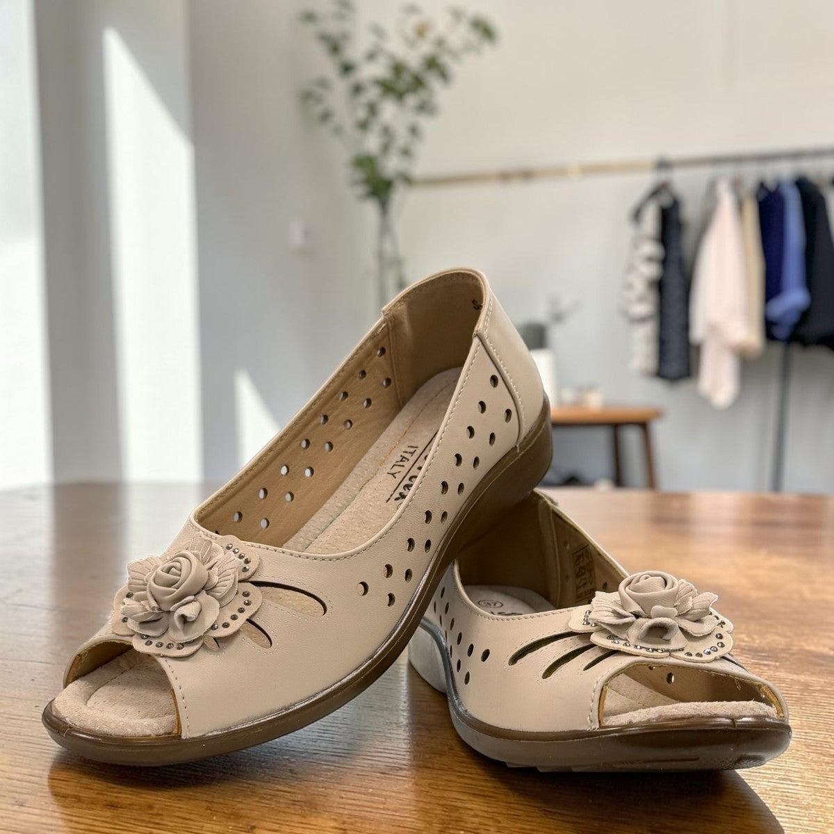 soflex-S230 beige peep-toe comfort flats with floral detail and breathable side perforations on a low wedge sole.
photo of the front side