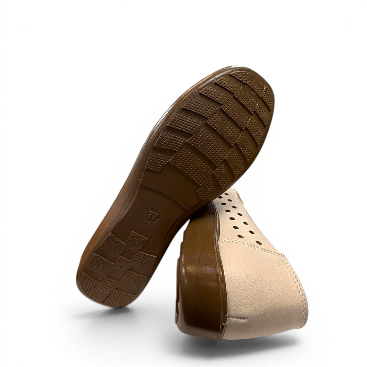 soflex-S230 beige peep-toe comfort flats with floral detail and breathable side perforations on a low wedge sole.
photo of the bottom side