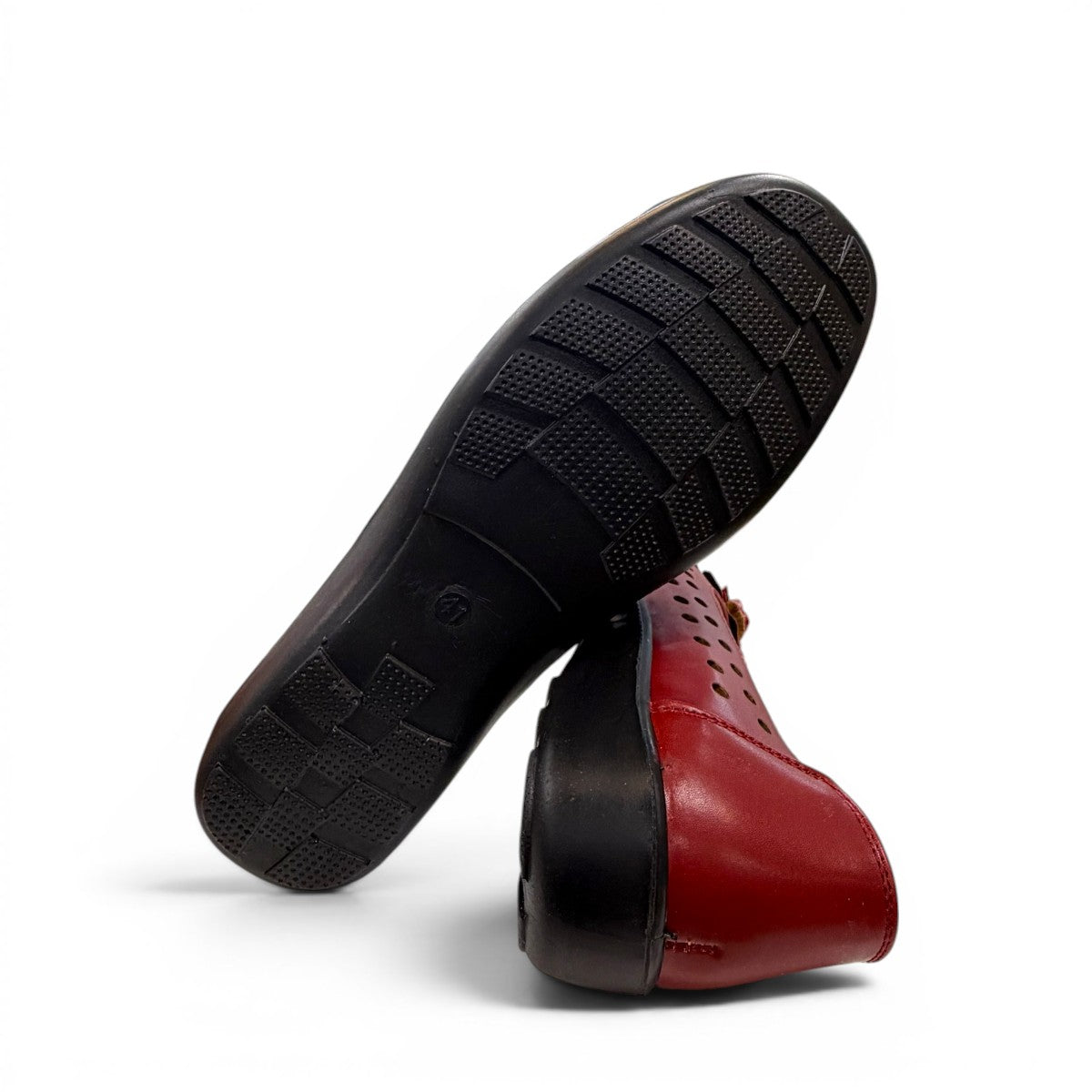 soflex-S230 red peep-toe comfort flats with floral detail, side perforations, and a flexible low-profile sole.
photo of the bottom side