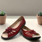 soflex-S230 red peep-toe comfort flats with floral detail, side perforations, and a flexible low-profile sole.
photo of the front side