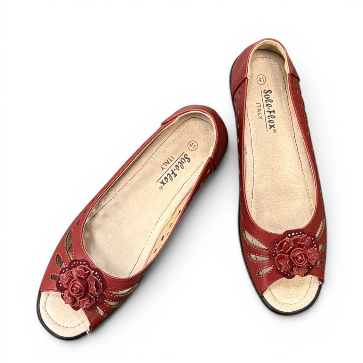 soflex-S230 red peep-toe comfort flats with floral detail, side perforations, and a flexible low-profile sole.
photo of the top side