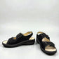 softline black leather Hedi wedge sandals with shiny finish, adjustable velcro straps, and decorative buckle.
photo of the front side