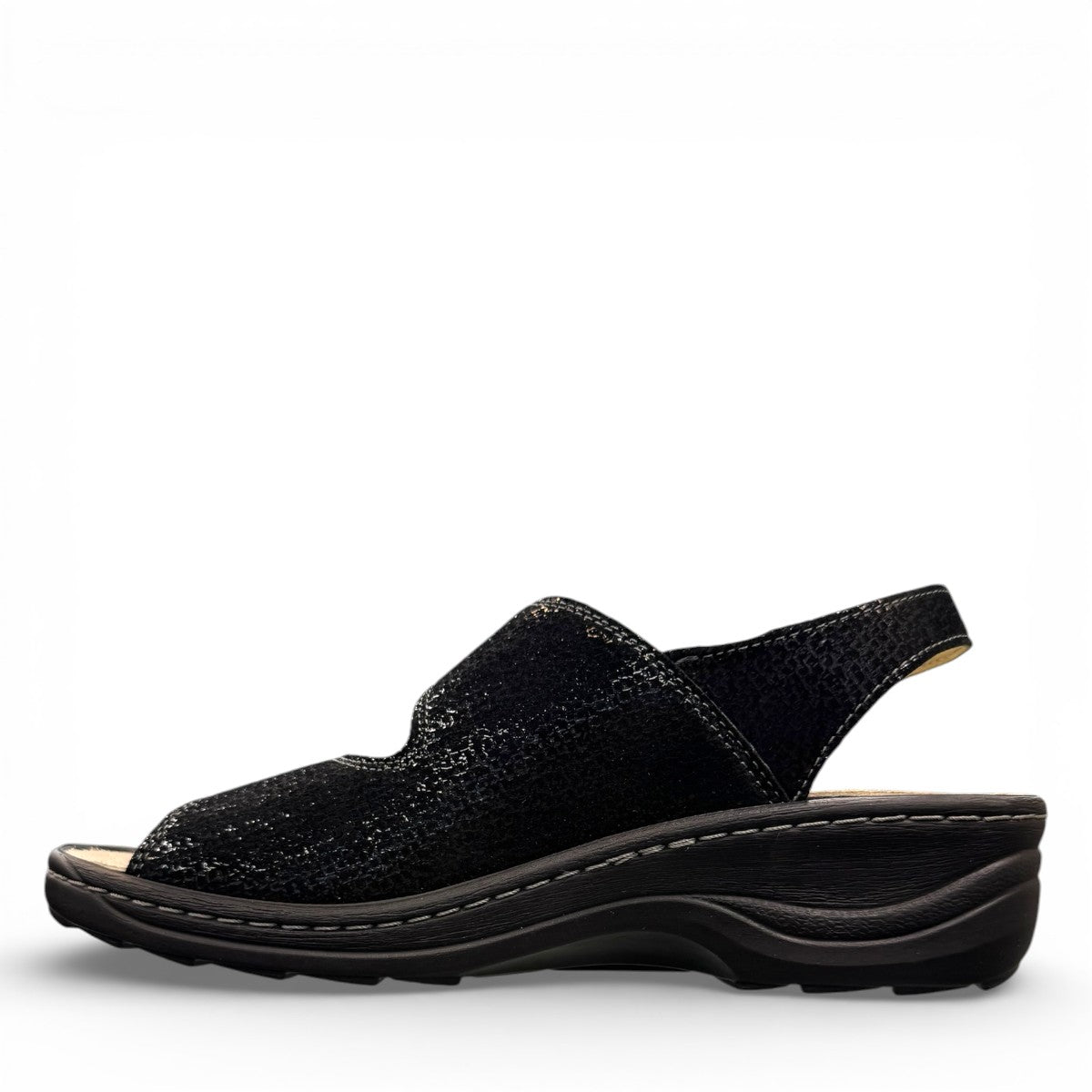 softline black leather Hedi wedge sandals with shiny finish, adjustable velcro straps, and decorative buckle.
photo of the left side