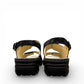 softline black leather Hedi wedge sandals with shiny finish, adjustable velcro straps, and decorative buckle.
photo of the back side