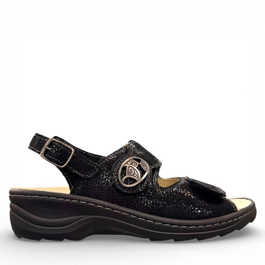 softline black leather Hedi wedge sandals with shiny finish, adjustable velcro straps, and decorative buckle.
photo of the right side