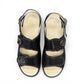 softline black leather Hedi wedge sandals with shiny finish, adjustable velcro straps, and decorative buckle.
photo of the top side