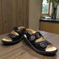 softline black leather Hedi wedge sandals with shiny finish, adjustable velcro straps, and decorative buckle.
photo of the front side