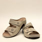 sole-flex-S1110 beige comfort slide sandals with adjustable straps, cut-out floral details, and a low wedge platform.
photo of the front side