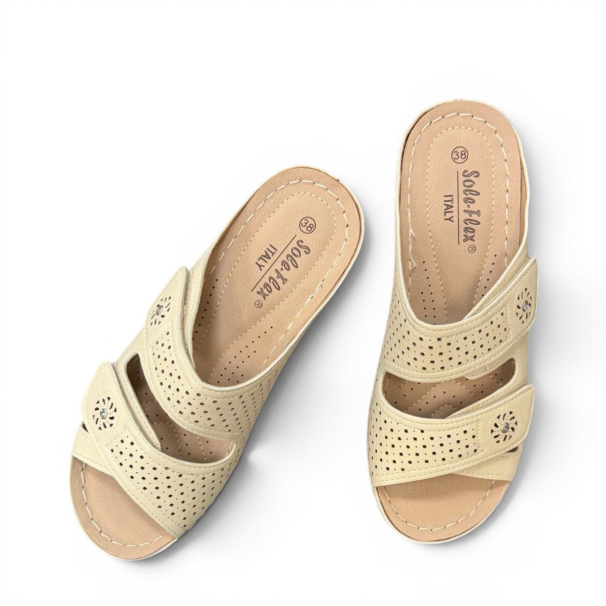 sole-flex-S1110 beige comfort slide sandals with adjustable straps, cut-out floral details, and a low wedge platform.
photo of the top side
