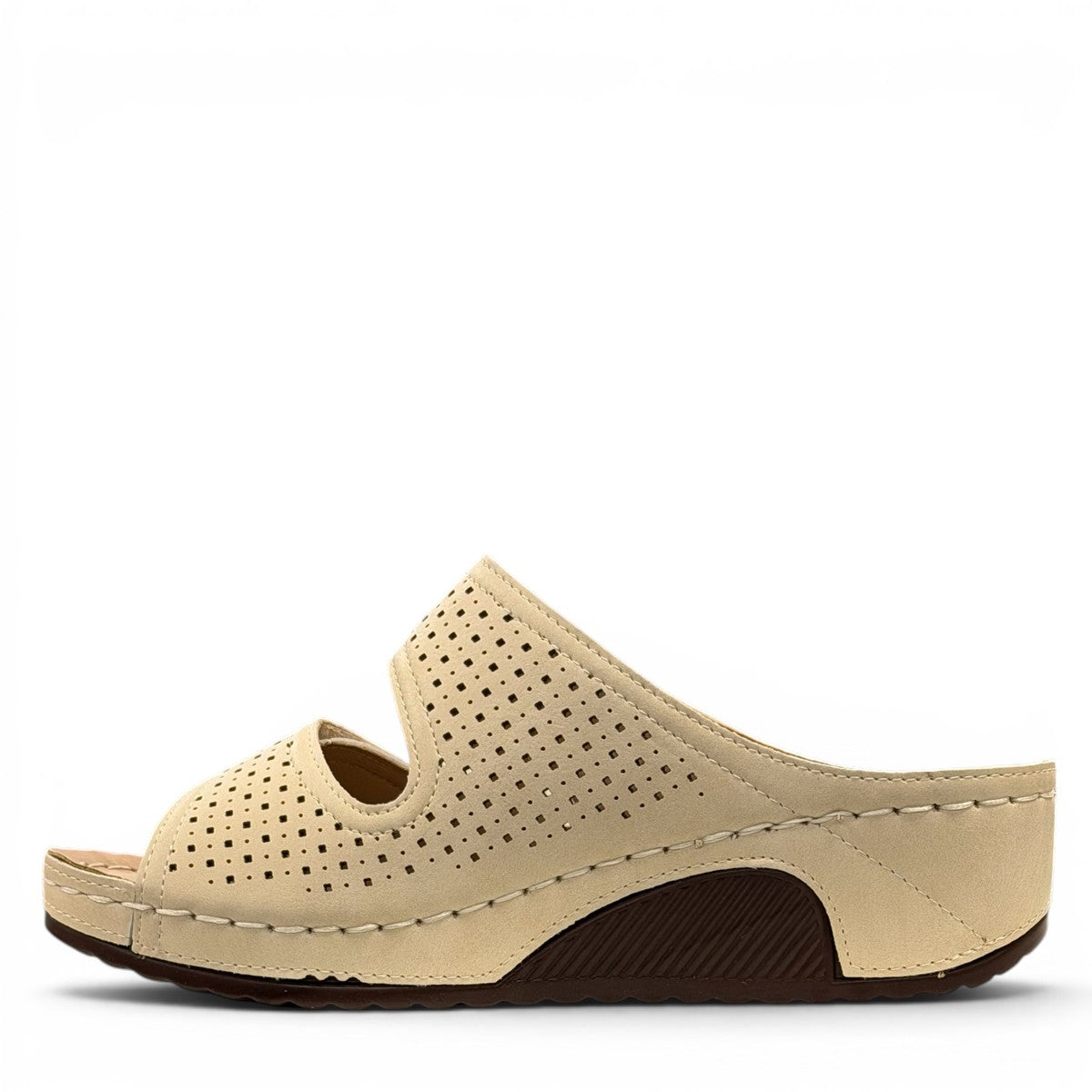 sole-flex-S1110 beige comfort slide sandals with adjustable straps, cut-out floral details, and a low wedge platform.
photo of the left side