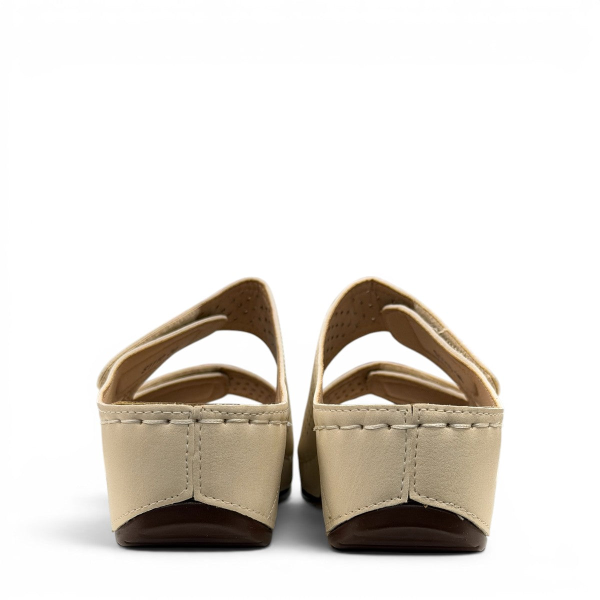 sole-flex-S1110 beige comfort slide sandals with adjustable straps, cut-out floral details, and a low wedge platform.
photo of the back side