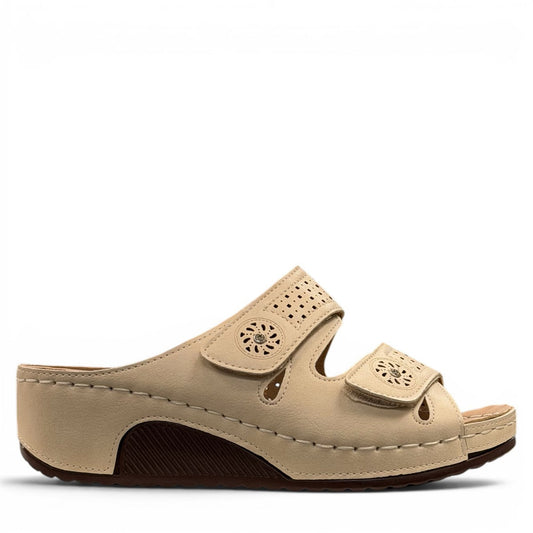 sole-flex-S1110 beige comfort slide sandals with adjustable straps, cut-out floral details, and a low wedge platform.
photo of the right side