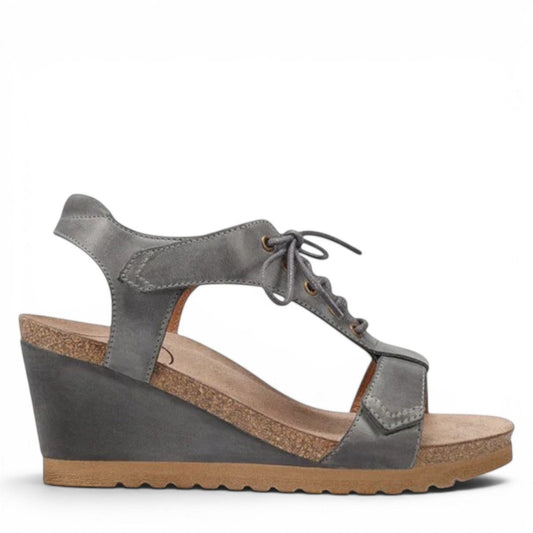 Taos Tie Wish steel grey leather wedge sandal with T-strap, lace-up detail, and cork-style midsole. Photo of outside side view.