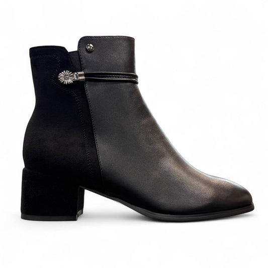 stefania F7001 black vegan leather dress booties with a block heel, fur lining, and decorative side button detail.
photo of the right side