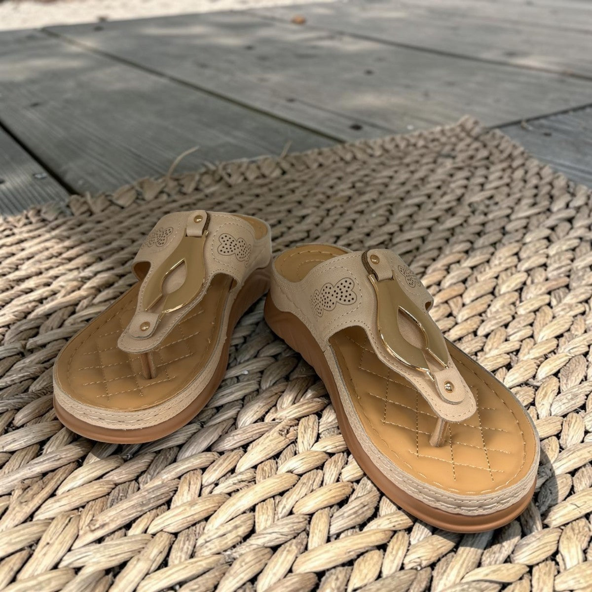 stefania S20211 beige vegan leather toe thong sandal with decorative buckle and cushioned sole for summer comfort.
photo of the front side