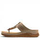 stefania S20211 beige vegan leather toe thong sandal with decorative buckle and cushioned sole for summer comfort.
photo of the left side