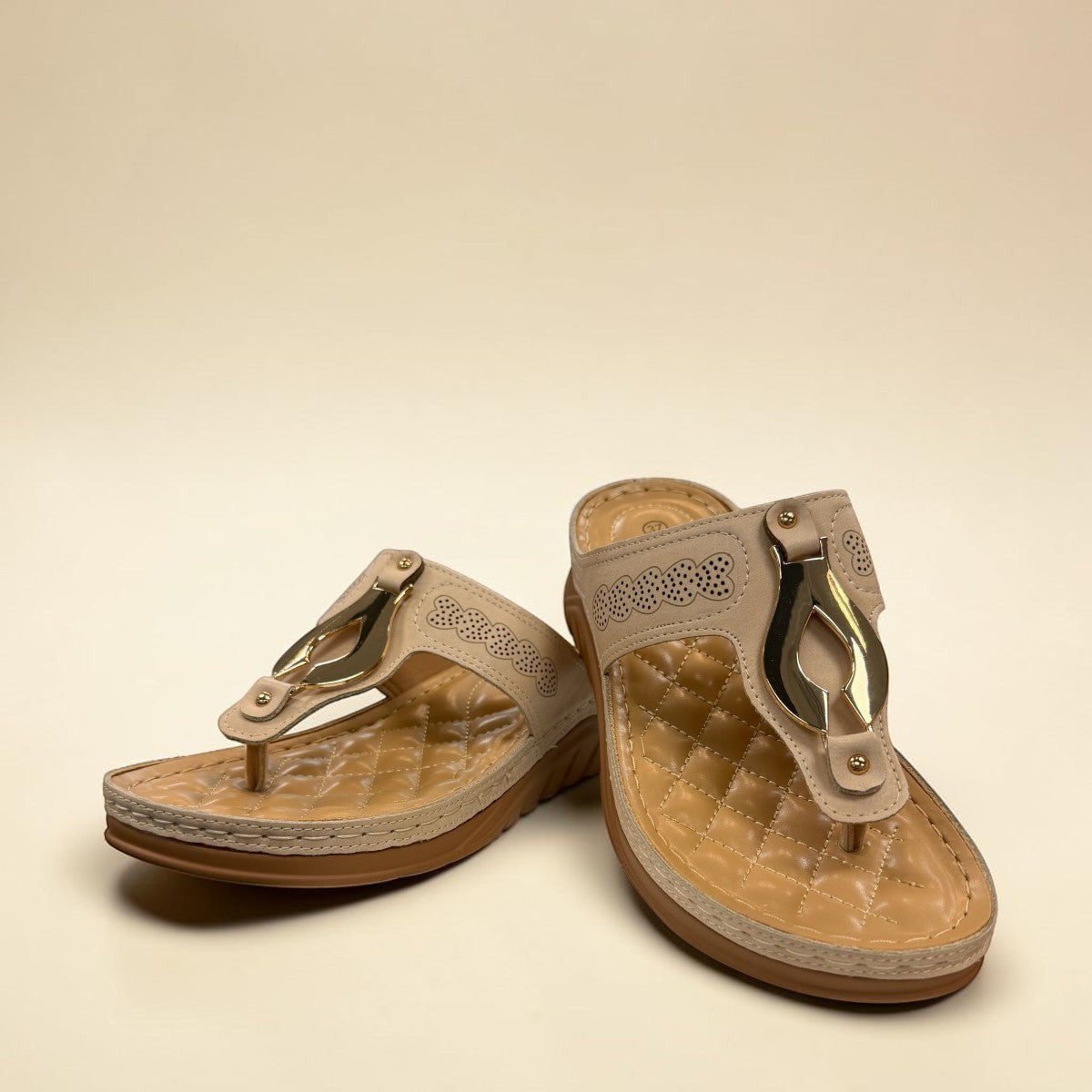 stefania S20211 beige vegan leather toe thong sandal with decorative buckle and cushioned sole for summer comfort.
photo of the front side