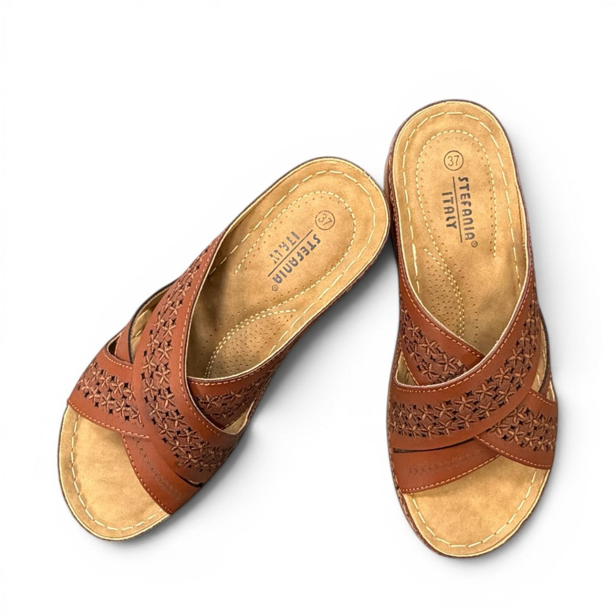 stefania camel vegan leather slide sandal with floral laser-cut details and a comfortable cushioned sole.
photo of the top side