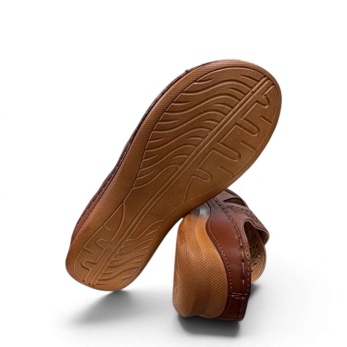 stefania camel vegan leather slide sandal with floral laser-cut details and a comfortable cushioned sole.
photo of the bottom side