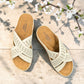 stefania S20215 white vegan leather slide sandals with floral cut-out details and a comfortable brown wedge sole.
 photo of the top side