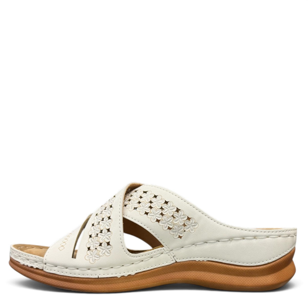 stefania S20215 white vegan leather slide sandals with floral cut-out details and a comfortable brown wedge sole.
 photo of the left side