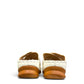 stefania S20215 white vegan leather slide sandals with floral cut-out details and a comfortable brown wedge sole.
 photo of the back side