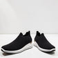 STEFANIA S4000 black slip-on knit platform sneakers with a white wedge sole and subtle shimmer details.
photo of the front side