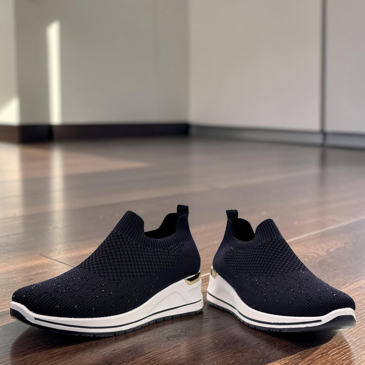 stefania S4000 navy blue slip-on knit platform sneakers with decorative shimmer and white wedge sole.
photo of the front side