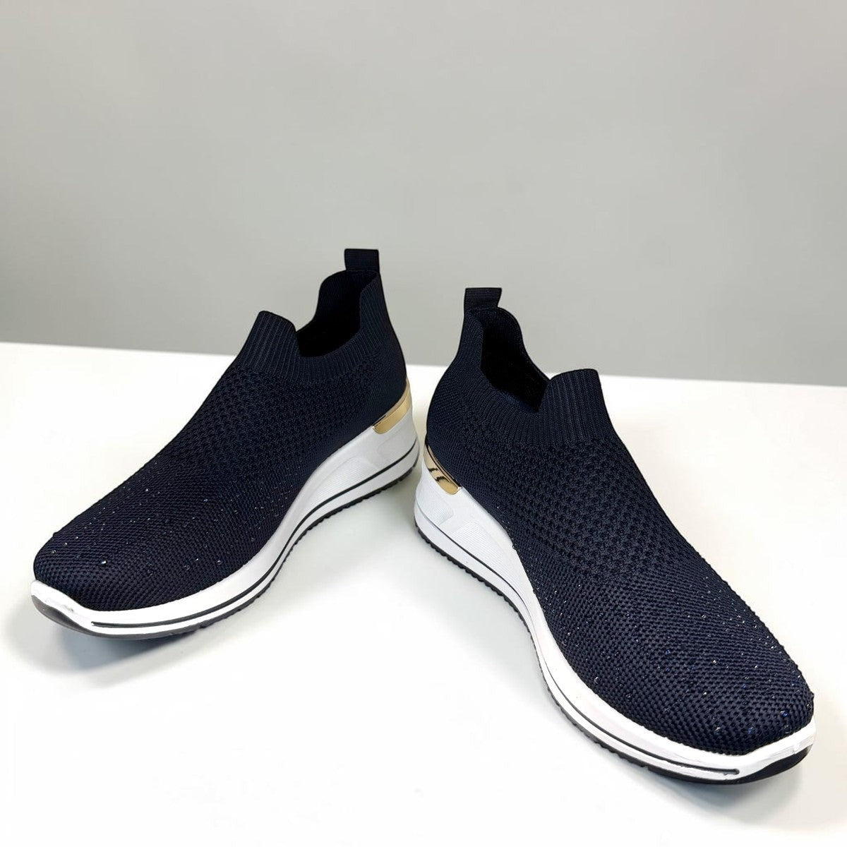 stefania S4000 navy blue slip-on knit platform sneakers with decorative shimmer and white wedge sole.
photo of the front side