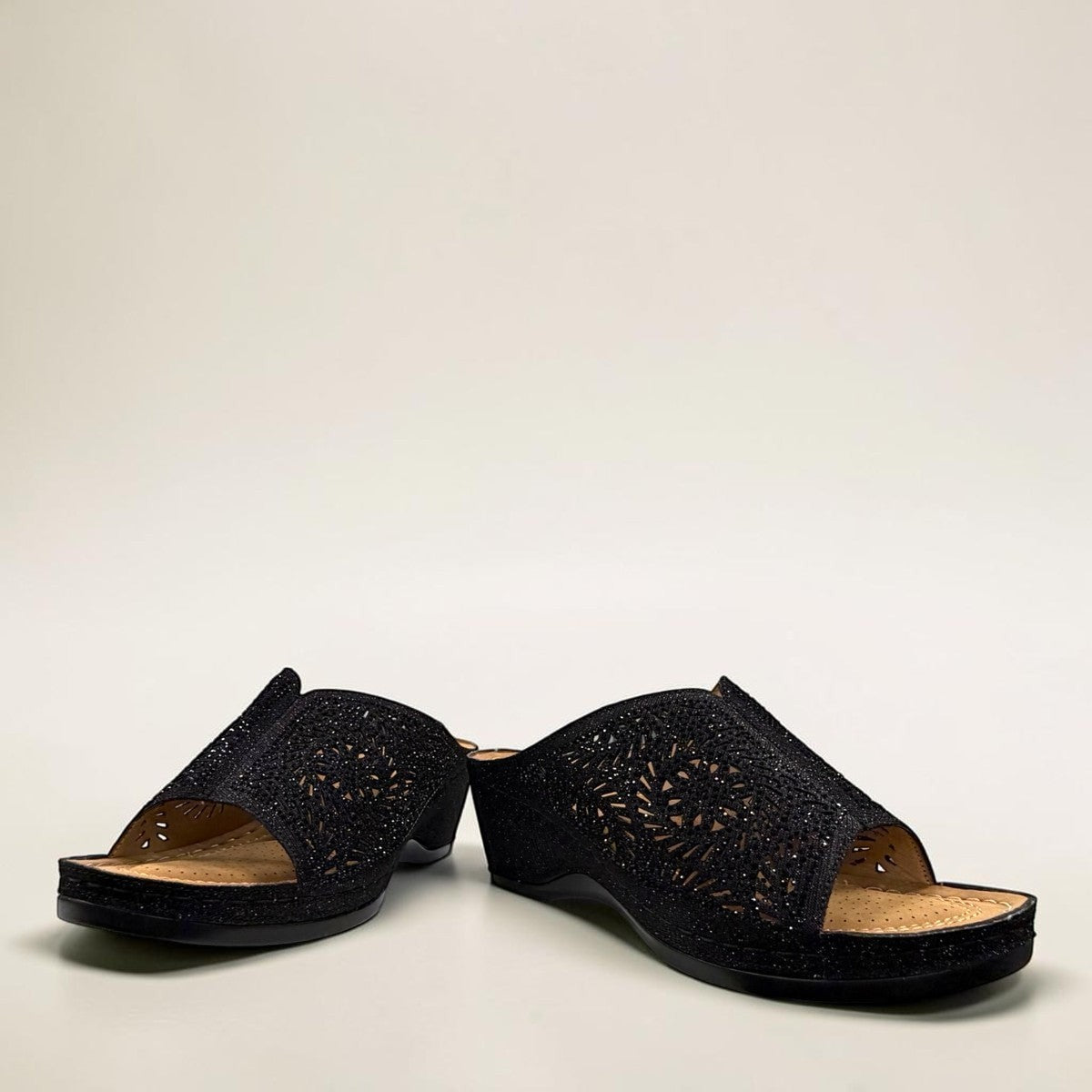 stefania S5036 black sparkle wedge sandals with elegant laser-cut detailing and a comfortable cushioned footbed.
photo of the front side