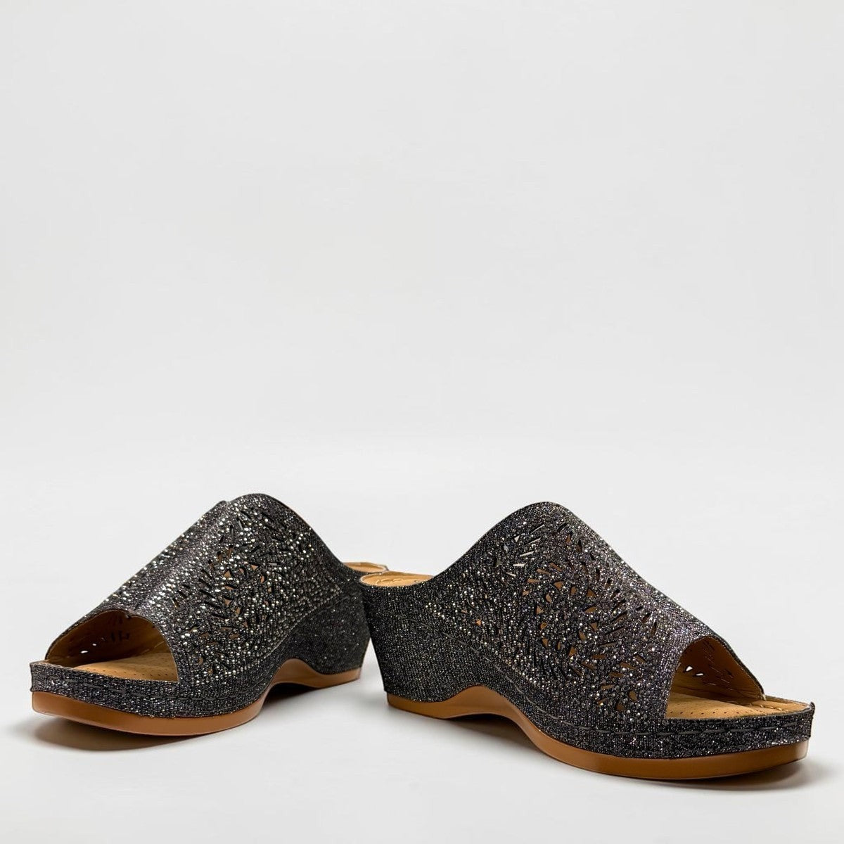 stefania S5036 pewter sparkle wedge sandals with elegant laser-cut detailing and a comfortable cushioned footbed.
photo of the front side