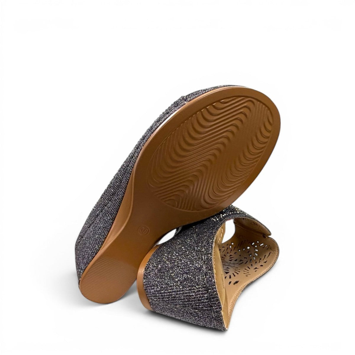 stefania S5036 pewter sparkle wedge sandals with elegant laser-cut detailing and a comfortable cushioned footbed.
photo of the bottom side