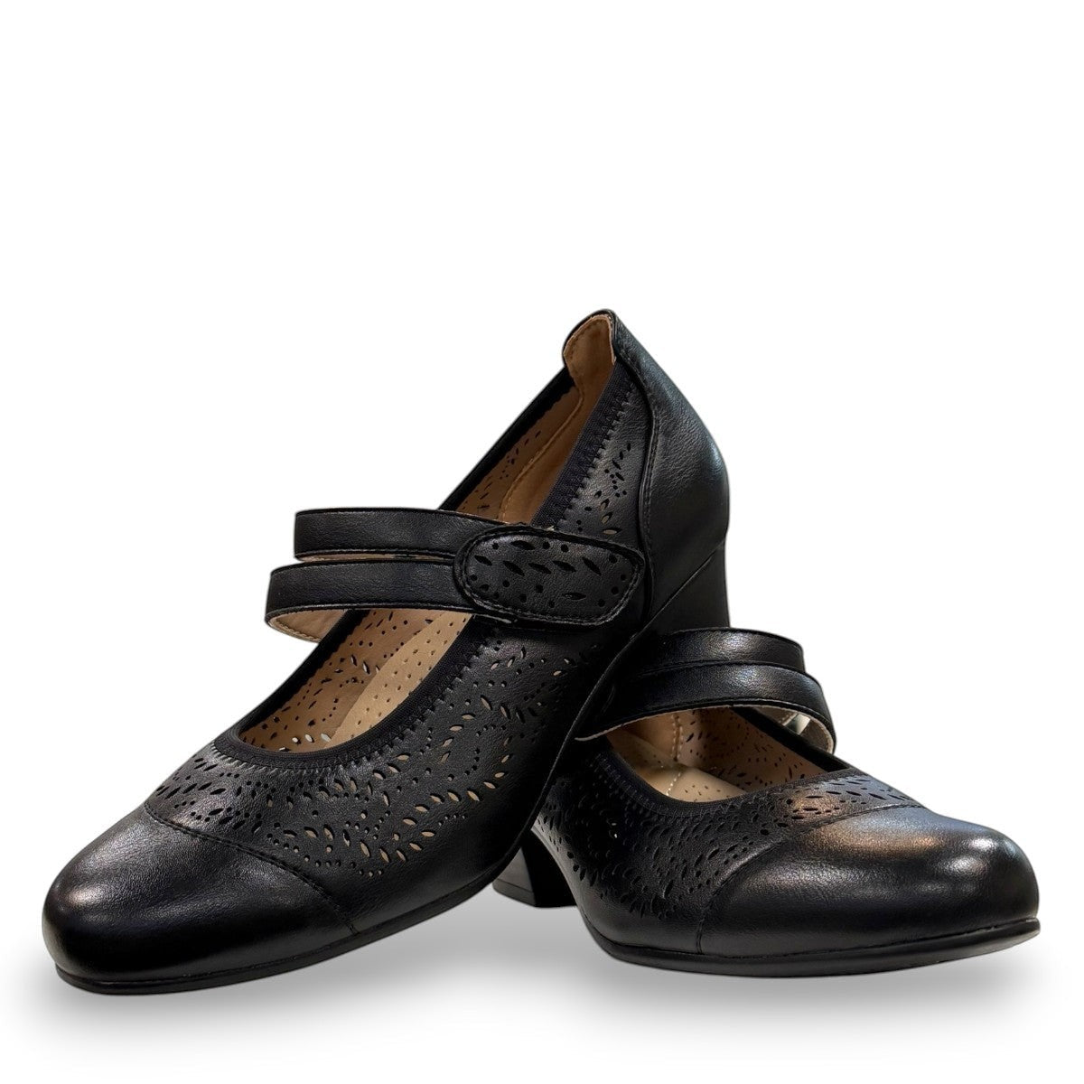 stefania aria black Mary Jane shoe with decorative laser-cut perforations, dual straps, and a stable block heel.
photo of the front side