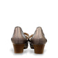 stefania aria pewter Mary Jane shoes with decorative laser-cut perforations, dual straps, and a stable block heel.
photo of the back side