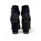 stefania black vegan leather dress booties with block heel, fur lining, and decorative side strap detail.
photo of the back side