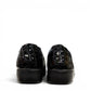 Stefania black croc-embossed slip-on shoe with a low wedge sole and elastic side panel for comfort.
photo of the back side