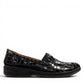 Stefania black croc-embossed slip-on shoe with a low wedge sole and elastic side panel for comfort.
photo of the right side
