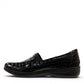 Stefania black croc-embossed slip-on shoe with a low wedge sole and elastic side panel for comfort.
photo of the left side