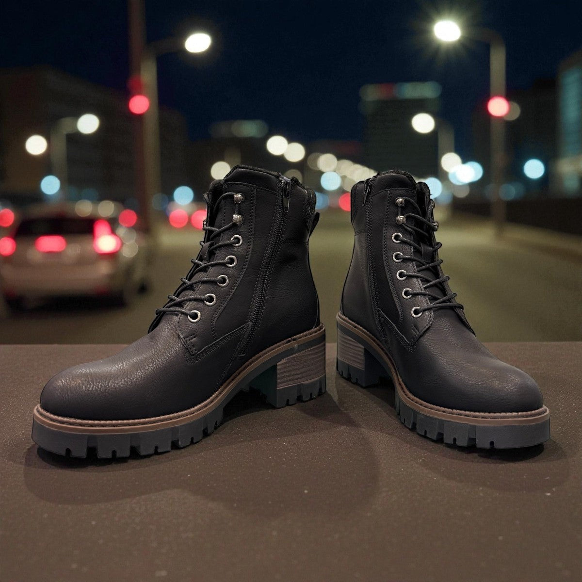 STEFANIA F700 black synthetic lace-up boot with knitted cuff, side zip, and chunky block heel.
photo of the front side
