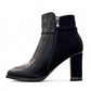 stefania black vegan leather dress booties with block heel, fur lining, and decorative side strap detail.
photo of the left side