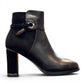 stefania black vegan leather dress booties with block heel, fur lining, and decorative side strap detail.
photo of the right side