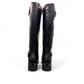 stefania black vegan leather high boots with side zipper, buckle detail, and block heel for winter wear.
photo of the back side