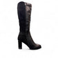 Stefania black vegan leather knee-high boots with fur lining, block heel, and metallic side detail.
photo of the left side
